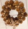 Christmas creation with pinecones gold