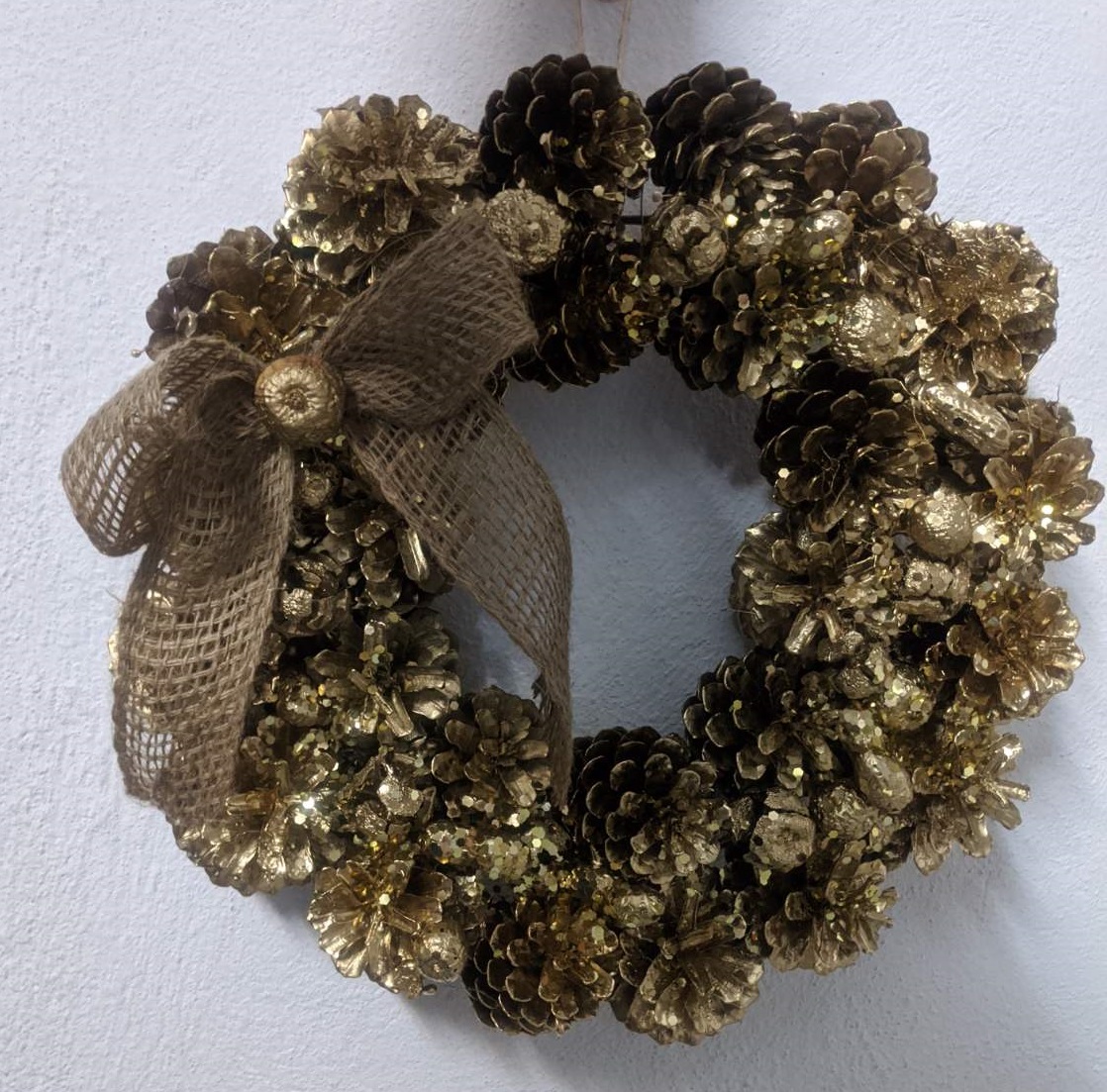 Christmas creation with pinecones gold